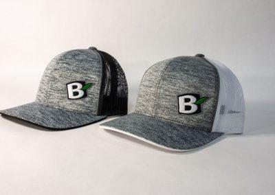 Two grey hats bearing the logo of Black Brook Lawn & Landscaping