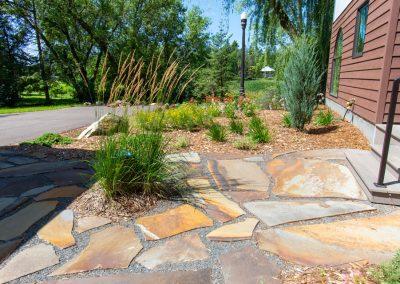 A small flagstone walkway leading to a home