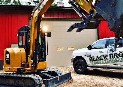 A Black Brook work truck and CAT excavator